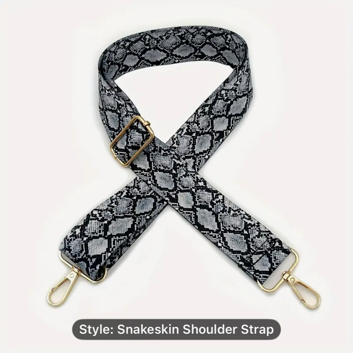 Snakeskin patterned shoulder strap with gold hardware